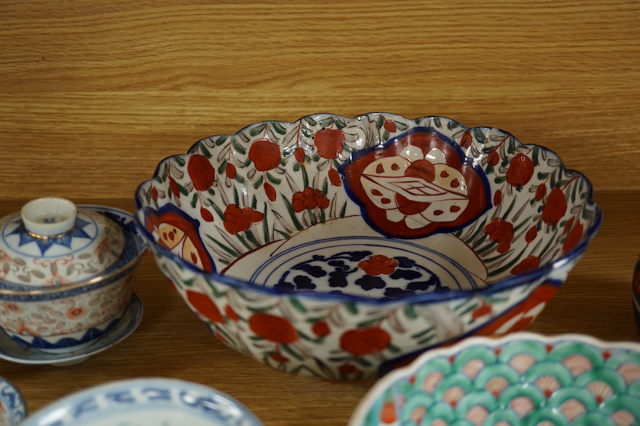 A collection of Chinese and Japanese porcelain to include 'rice grain' bowls, covers & stands and 19th century Japanese Imari, largest 25cm. Condition - mostly fair/good